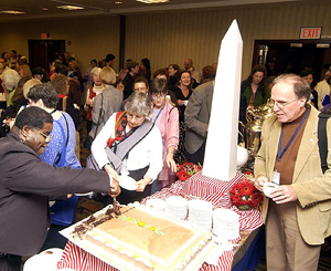 Attendees enjoying cake in celebration of the Library of the Year award.